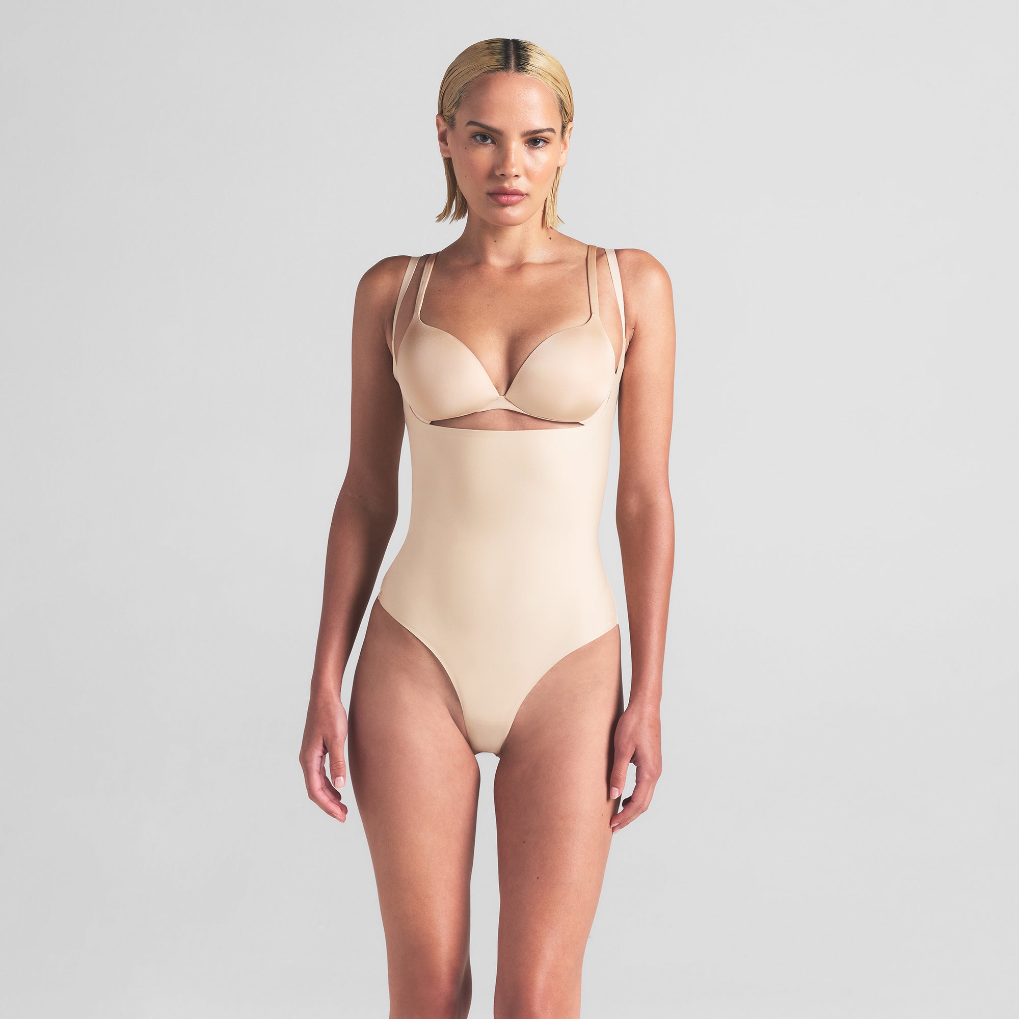 SKIMS BODY CORE SCULPT OPEN BUST THONG BODYSUIT | SAND