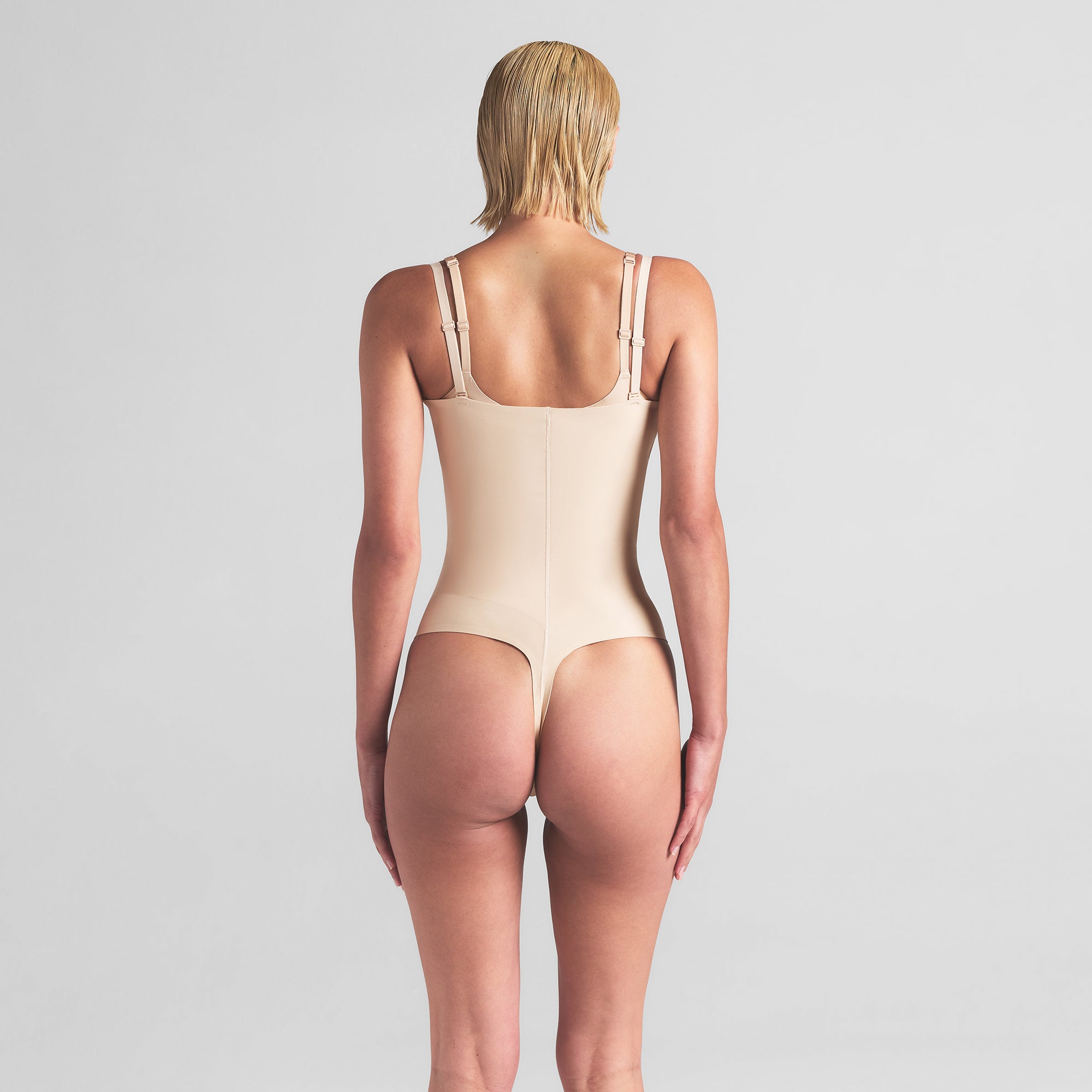 SKIMS BODY CORE SCULPT OPEN BUST THONG BODYSUIT | SAND - Image 4